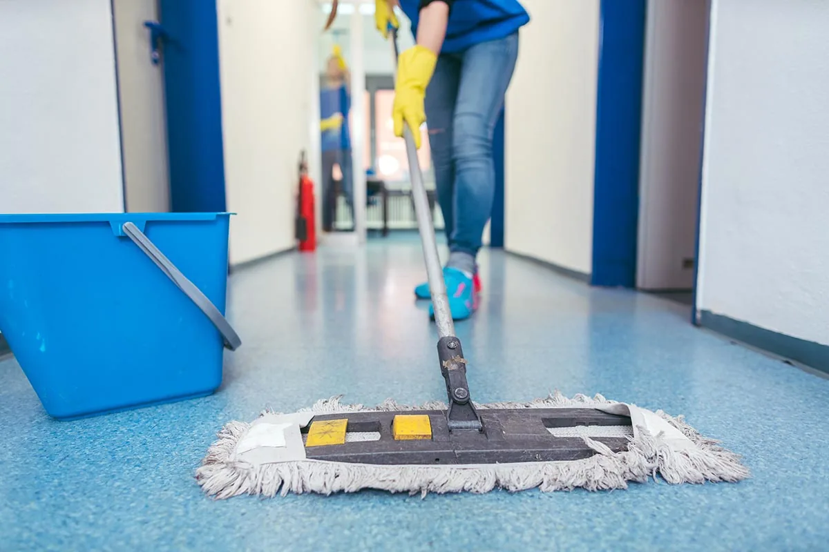 Platinum Facility Services team member preparing equipment for commercial cleaning